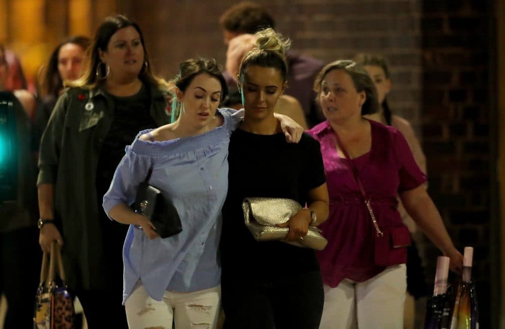 Police escort members of the public from the Manchester Arena on May 23, 2017 in Manchester, England. (Christopher Furlong/Getty Images)