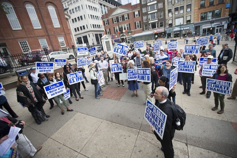 A group of Environmental Protection Agency workers in Boston and their supporters gathered at Boston Common Wednesday before heading toward the State House to protest President Trump's budget proposal. (Jesse Costa/WBUR)