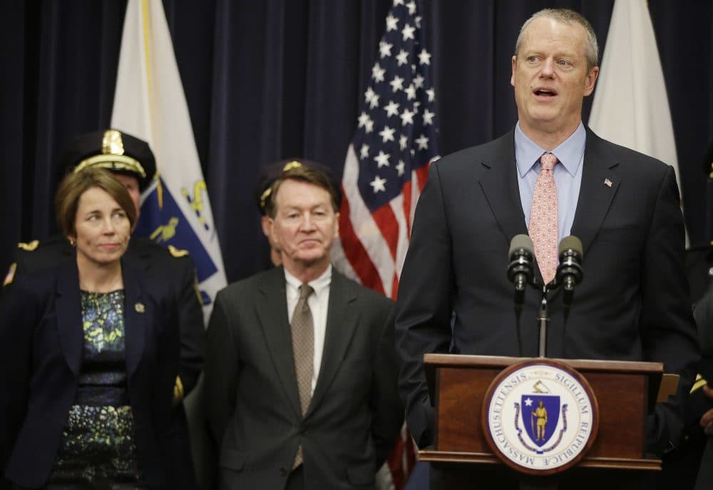 Republican Gov. Charlie Baker and Democratic Attorney General Maura Healey on Tuesday introduced legislation to modernize the state's nearly half-century-old wiretapping law to better reflect, in their view, the current criminal and technological landscape. (Stephan Savoia/AP)