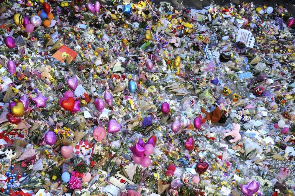Flower tributes for the victims of Monday's bombing are seen at St Ann's Square in central Manchester, Britain, on Friday. (Rui Vieira/AP)