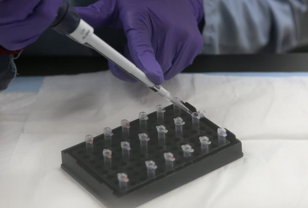 A criminalist works on mitochondrial DNA testing at a State of California Department of Justice laboratory in 2012. (Jeff Chiu/AP)