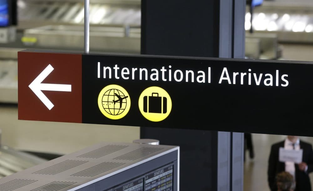 A sign for International Arrivals is shown at the Seattle-Tacoma International Airport, Monday, June 26, 2017, in Seattle. (Ted S. Warren/AP)