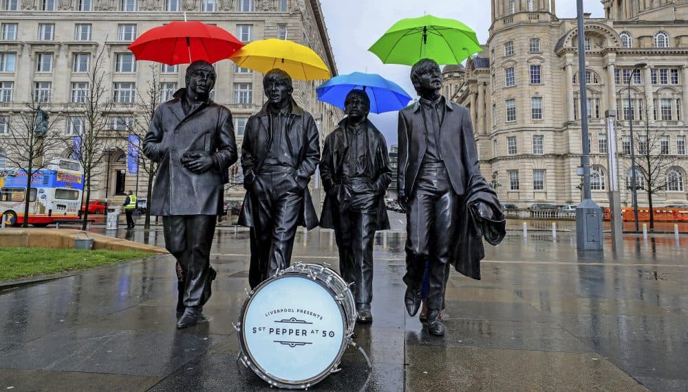 Umbrellas were placed over the statutes of the Beatles in Liverpool, England earlier this year. (Peter Byrne/PA via AP)