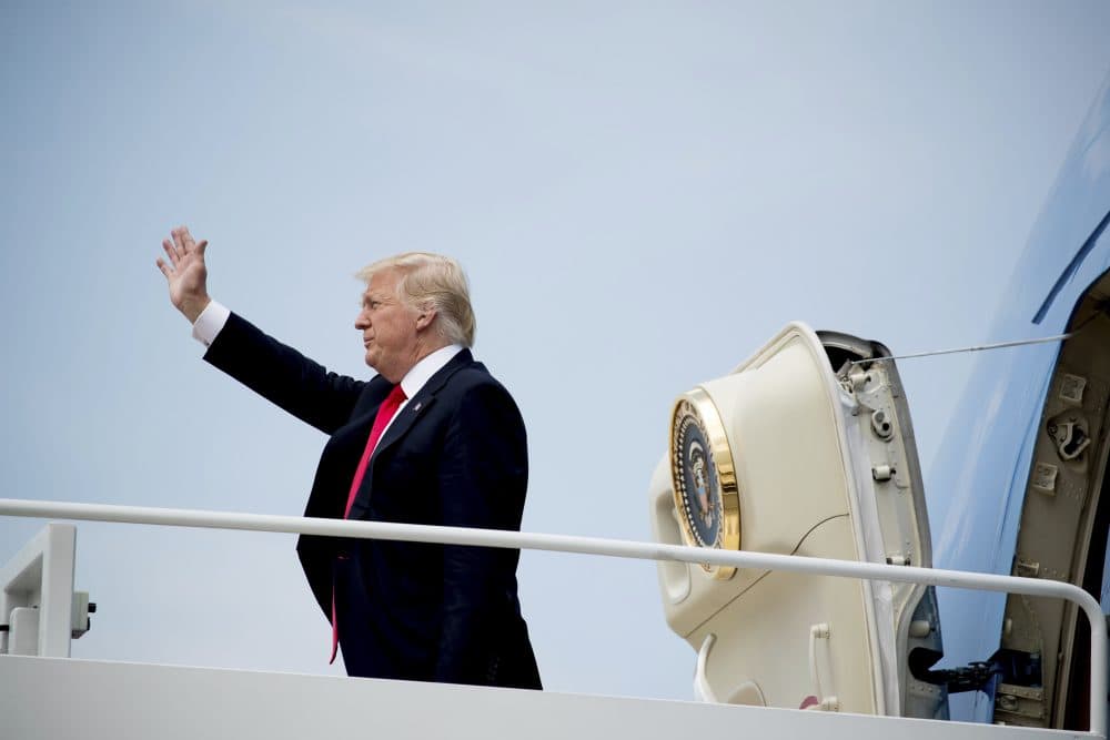 President Trump waves as he boards Air Force One at Andrews Air Force Base on Tuesday. (Andrew Harnik/AP)