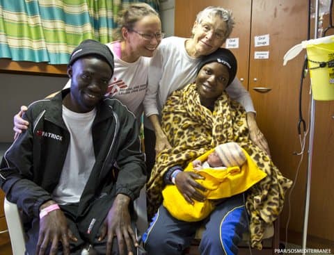 Liza Ramlow with migrants rescued on Médecins Sans Frontières' search and rescue boat, the Aquarius. (Courtesy Médecins Sans Frontières)