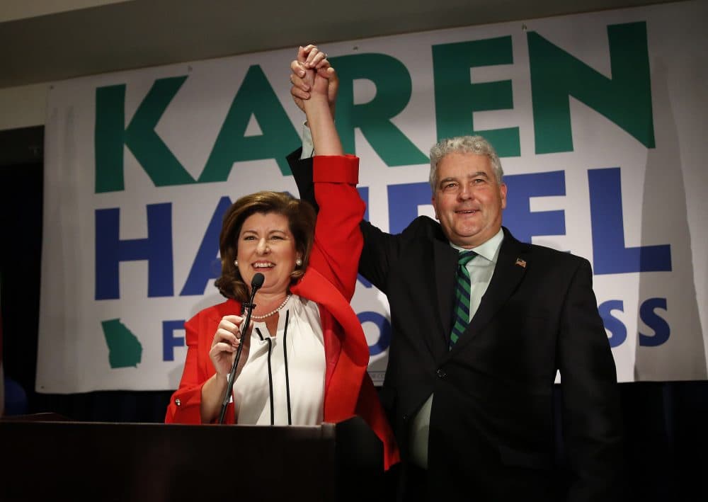 Democrats lose two more Congressional races, the Supreme Court will hear a case on gerrymandering and part of Yawkey Way becomes David Ortiz Drive. All that and more from Tom Keane’s weekly news roundup. Pictured: Republican candidate for Georgia's 6th District Congressional seat Karen Handel celebrates with her husband Steve, June 20, 2017, in Atlanta. (John Bazemore/AP)