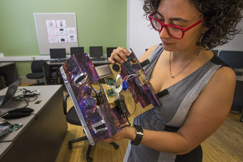 Artist Lina Maria Giraldo demonstrates how to use one of the video cameras created during her program at the Hyde Park Community Center. (Jesse Costa/WBUR)