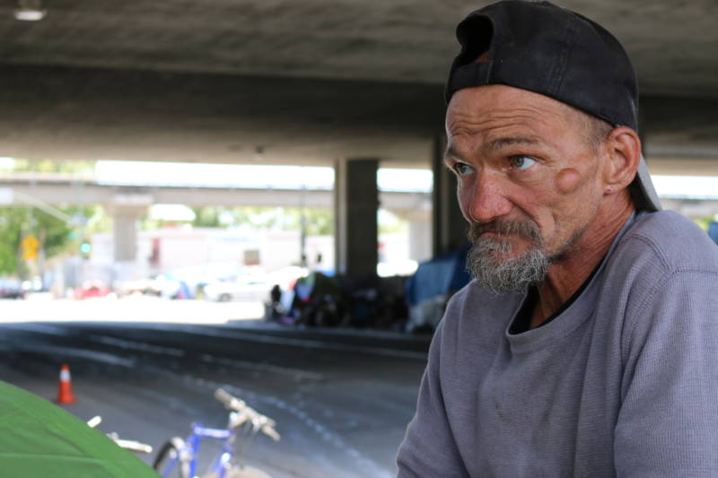 Jeffrey Hill's tent burned down in an encampment fire in late May 2017. The cause of the fire is not known. Hill calls his encampment at Fifth and Brush streets a &quot;family,&quot; but also says it has become harder to maintain order as the encampment has grown in size. (Devin Katayama/KQED)