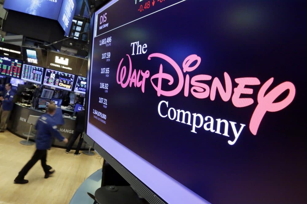 In this Monday, Aug. 7, 2017, photo, The Walt Disney Co. logo appears on a screen above the floor of the New York Stock Exchange. (Richard Drew/AP)