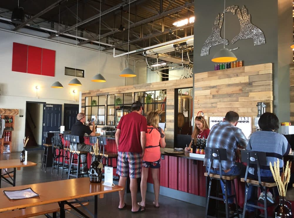 Inside Idle Hands Craft Ales taproom in Malden. (Pien Huang for WBUR)