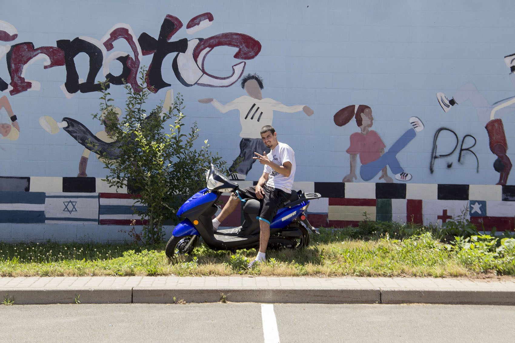 CJ Gee has a reputation for popping wheelies on New Haven streets. Normally, he rides a pedal bike. (Courtesy Chasan Hall)