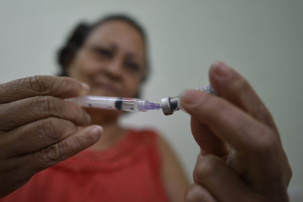 People line up to receive the yellow fever vaccine at a public health post in Caratinga, in the southeastern state of Minas Gerais, Brazil, on Jan. 13, 2017. (Douglas Magno/AFP/Getty Images)