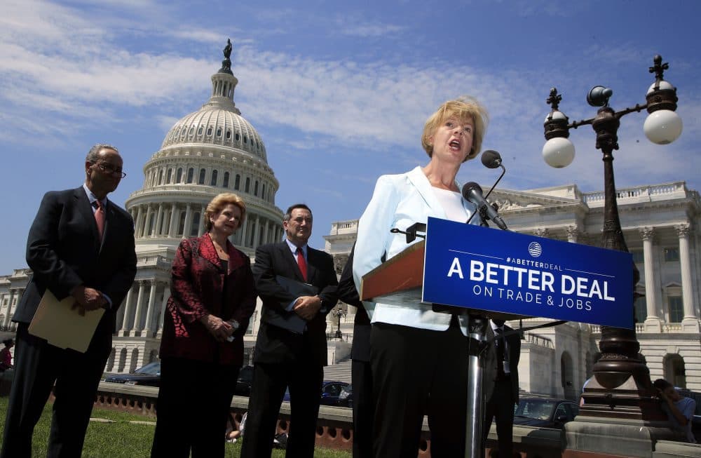 Sen. Tammy Baldwin, D-Wis., right, accompanied by, from left, Senate Minority Leader Chuck Schumer of N.Y., Sen. Debbie Stabenow, D-Mich., and Sen. Bob Casey, D-Pa., speaks on Capitol Hill in Washington, Wednesday, Aug. 2, 2017, to unveil "A Better Deal On Trade and Jobs," to put American workers first and fight back against companies that outsource jobs and countries that manipulate trade laws. (Manuel Balce Ceneta/AP)
