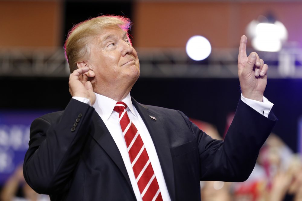 President Donald Trump reacts to the song as he arrives at a rally at the Phoenix Convention Center, Tuesday, Aug. 22, 2017, in Phoenix. (Alex Brandon/ AP)