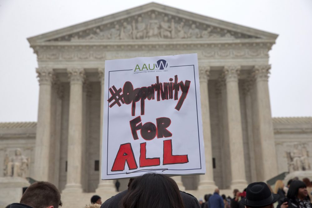 The right, and now Attorney General Jeff Sessions, transforms Asian-Americans into honorary whites, writes Margaret Burnham, for political purposes in the affirmative action debate. Pictured: Pamela Yuen, with the American Association of University Women, holds a sign in favor of affirmative action outside of the Supreme Court in Washington, Wednesday, Dec. 9, 2015, as the court hears oral arguments in the Fisher v. University of Texas at Austin affirmative action case. (Jacquelyn Martin/AP)