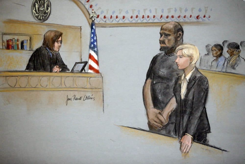 In this courtroom sketch, David Wright, second from left, is depicted standing with his attorney during a 2015 hearing in federal court in Boston. (Jane Flavell Collins/AP)