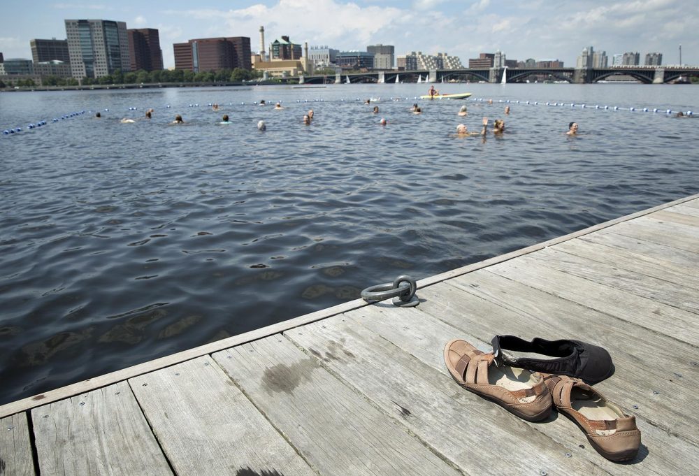 A pair of shoes and a sun visor on the dock await their owner, at City Splash. (Robin Lubbock/WBUR)