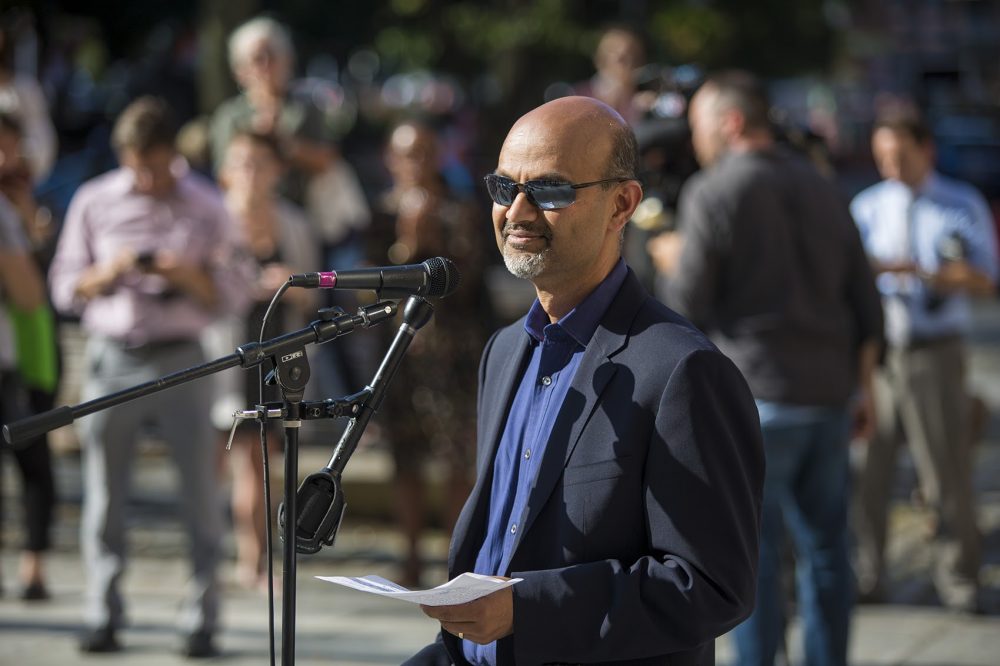 Carbonite CEO Mohamad Ali spoke during a rally in Faneuil Hall Tuesday against the Trump administration's decision to end DACA. (Jesse Costa/WBUR)