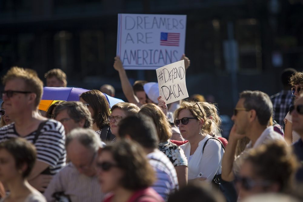 People gathered at Faneuil Hall in Boston Tuesday to protest the Trump administration's decision to end the Deferred Action for Childhood Arrivals program, which granted temporary status to some people whose parents brought them into the country illegally as children. (Jesse Costa/WBUR)