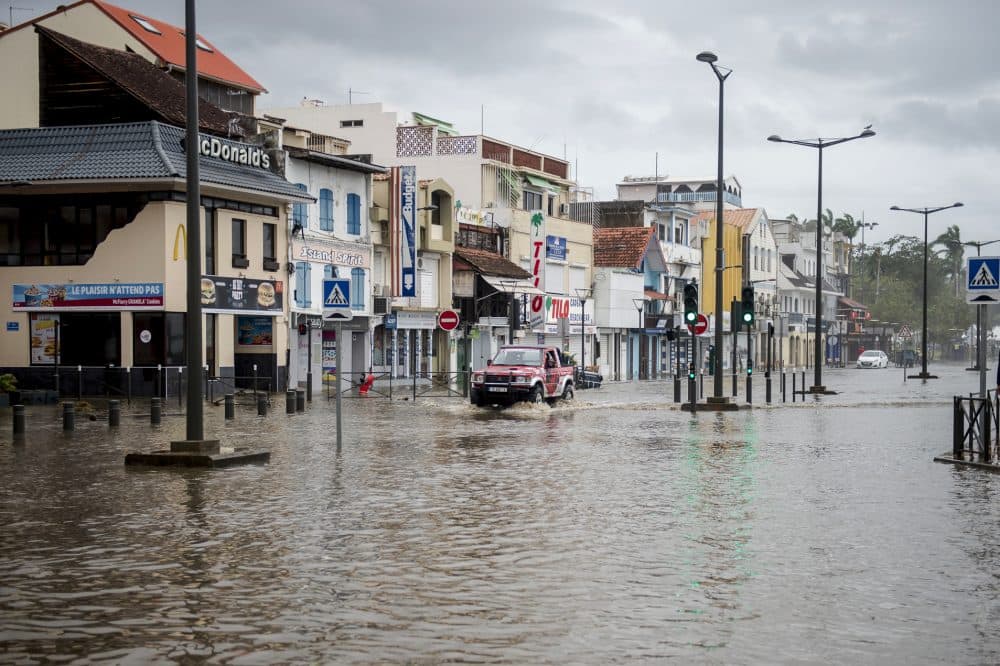A motorist drives on the flooded waterfront in Fort-de-France, on the French Caribbean island of Martinique, after it was hit by Hurricane Maria, on Sept. 19, 2017. Martinique, suffered power outages but avoided major damage. (Lionel Chamoiseau/AFP/Getty Images)