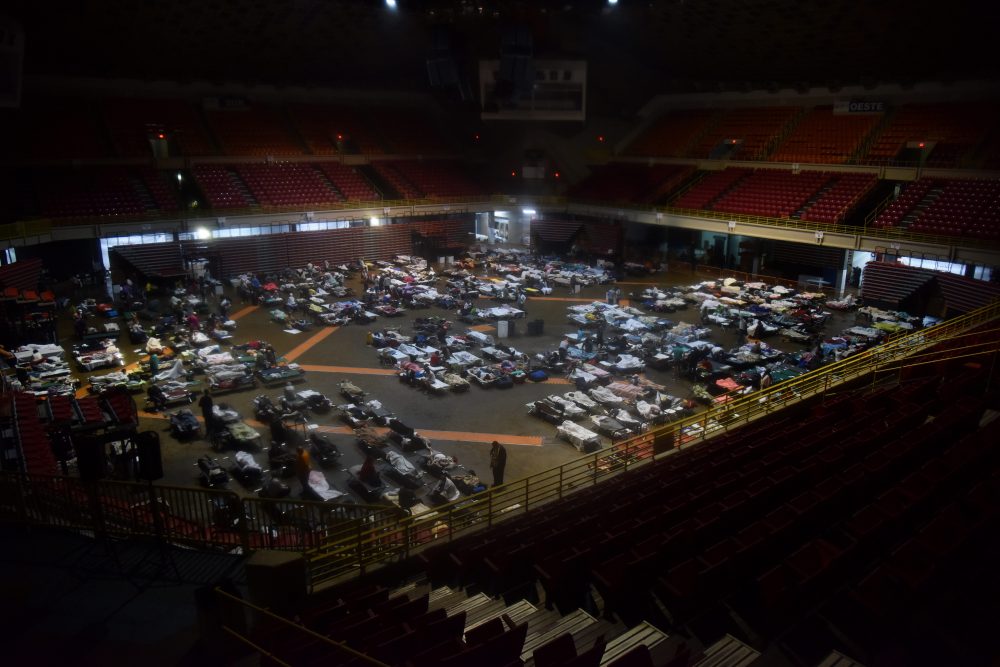 Residents seek shelter inside Roberto Clemente Coliseum in San Juan, Puerto Rico, early on Sept. 20, 2017, as Hurricane Maria passes the island. (Hector Retamal/AFP/Getty Images)