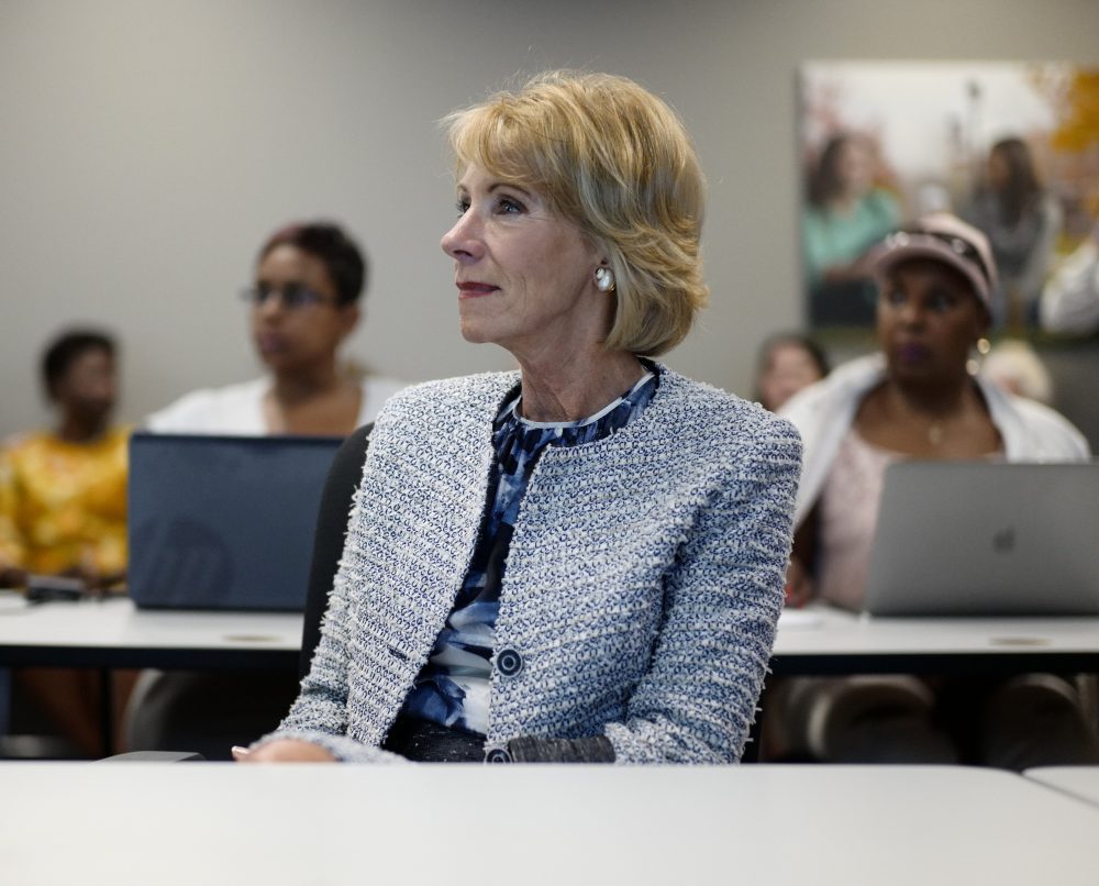 US Education Sect. Betsy DeVos sits in on a coding class in Omaha, Neb., Wednesday, Sept. 13, 2017, during a visit to the Midland University-Omaha Campus for her 2017 "Rethink School" tour, in which she will visit schools in Wyoming, Colorado, Nebraska and Kansas. (AP Photo/Nati Harnik)