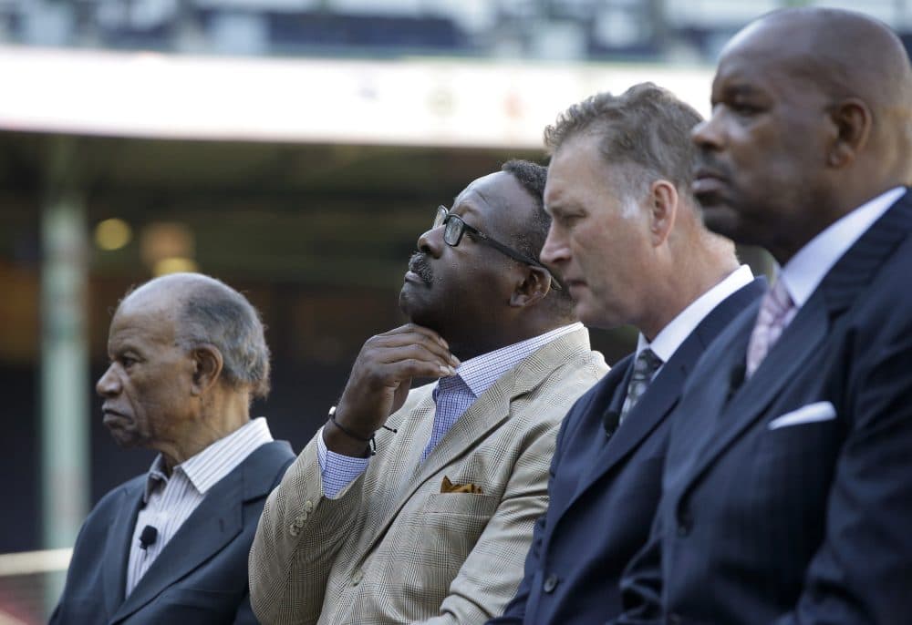 Boston Red Sox Hall of Famer Tommy Harper, NFL Hall of Fame linebacker Andre Tippett, Bob Sweeney, executive director of the Boston Bruins Foundation, and Cedric Maxwell, former Boston Celtics player, right, participate in a panel discussion held to introduce an initiative called "Take The Lead." (Steven Senne/AP)
