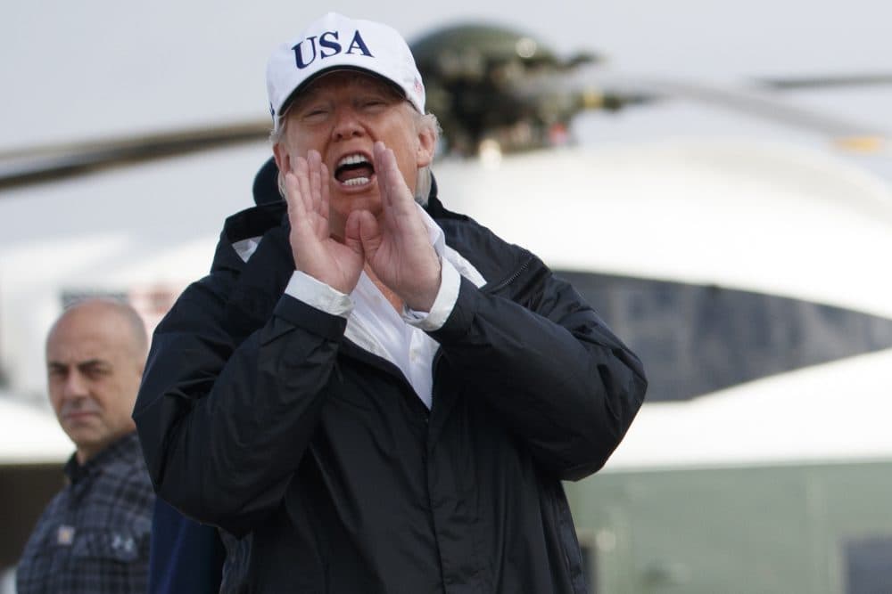 President Donald Trump responds to a reporters question as he boards Air Force One with first lady Melania Trump, not shown, for a trip to Florida to meet with first responders and people impacted by Hurricane Irma, Thursday, Sept. 14, 2017, in Andrews Air Force Base, Md. (Evan Vucci/AP)