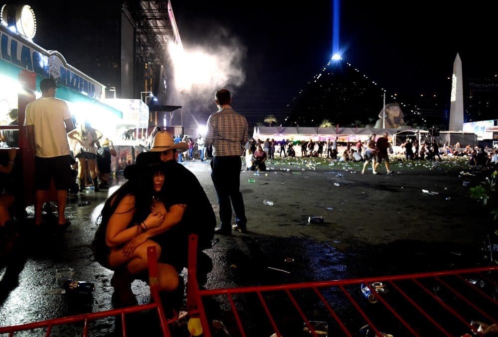 People take cover at the Route 91 Harvest country music festival after gunfire was heard on Oct. 1, 2017 in Las Vegas, Nev. (David Becker/Getty Images)