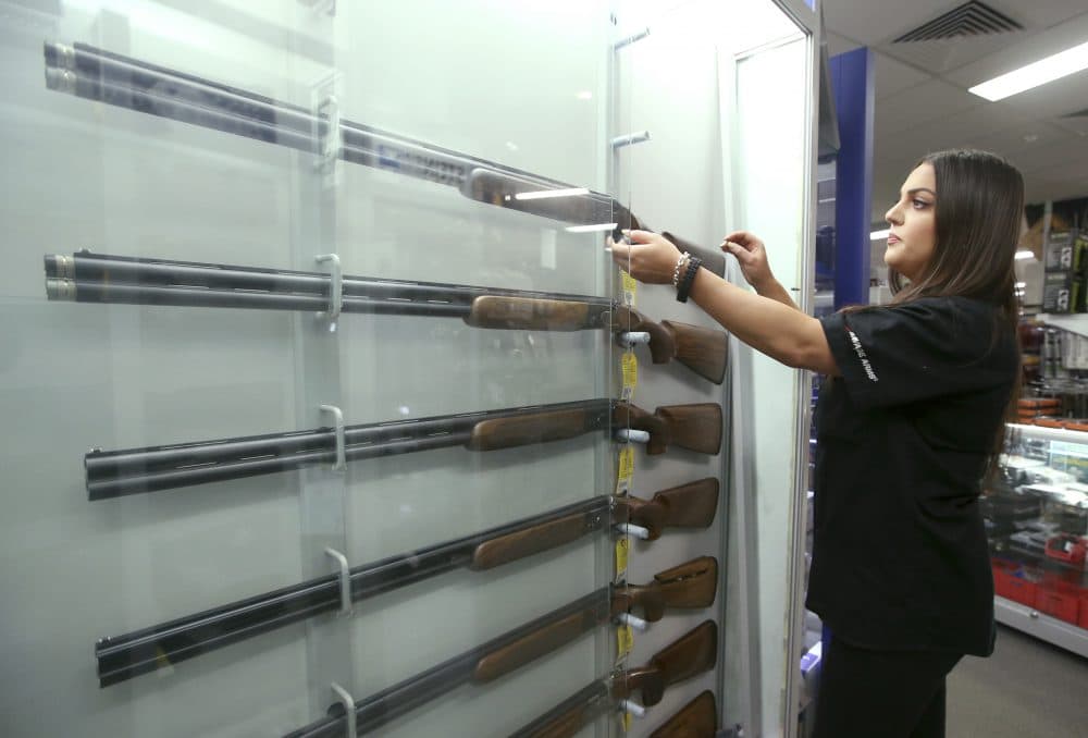 Salesperson Lauren Ungari handles a firearm at a display in a gun shop in Sydney, Australia, Wednesday, Oct. 4, 2017. Former Australian Deputy Prime Minister Tim Fischer, who helped win over a hostile Australian pro-gun lobby to the idea of massive weapons reform says the overwhelmingly success of the change should serve as an example for American politicians in the wake of the Las Vegas massacre. (Rick Rycroft/AP)