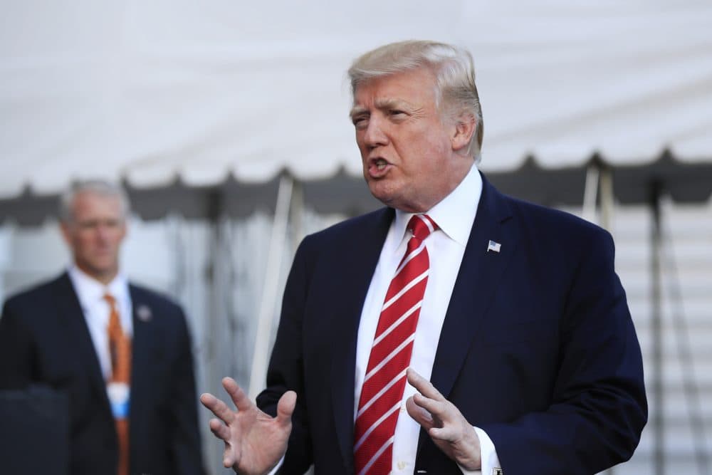 In this Oct. 7, 2017, photo, President Donald Trump speaks to reporters before leaving the White House in Washington for a brief stop at Andrews Air Force Base in Md., on his way to Greensboro, N.C. The Trump administration sent an immigration policy wish-list to Congress that includes overhauling the country's green-card system, hiring 10,000 more immigration officers and building a wall along the southern border. (Manuel Balce Ceneta/AP)