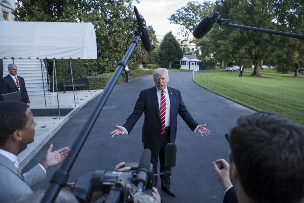 President Trump speaks with reporters outside the White House prior to his departure aboard Marine One on Oct. 7, 2017. During the exchange, President Trump called NBC News "fake news" after the news agency reported tension between Trump and Secretary of State Rex Tillerson. (Alex Edelman/AFP/Getty Images)