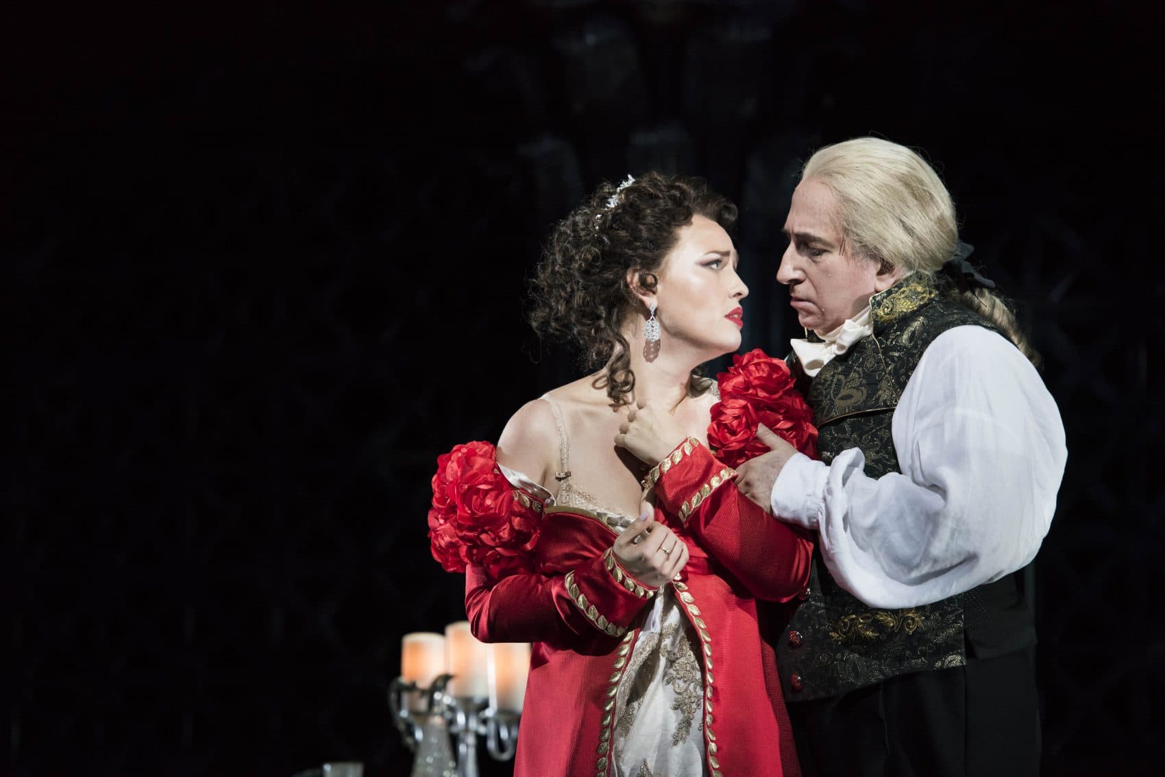 Tosca, portrayed by Elena Stikhina, submits to Scarpia, played by Daniel Sutin, to save the life of her true love in the Boston Lyric Opera production of "Tosca." (Courtesy Liza Voll/Boston Lyric Opera)
