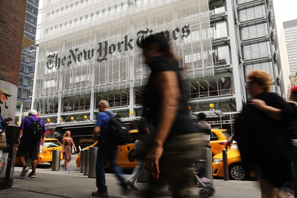 People walk past the New York Times building on July 27, 2017 in New York City. (Spencer Platt/Getty Images)