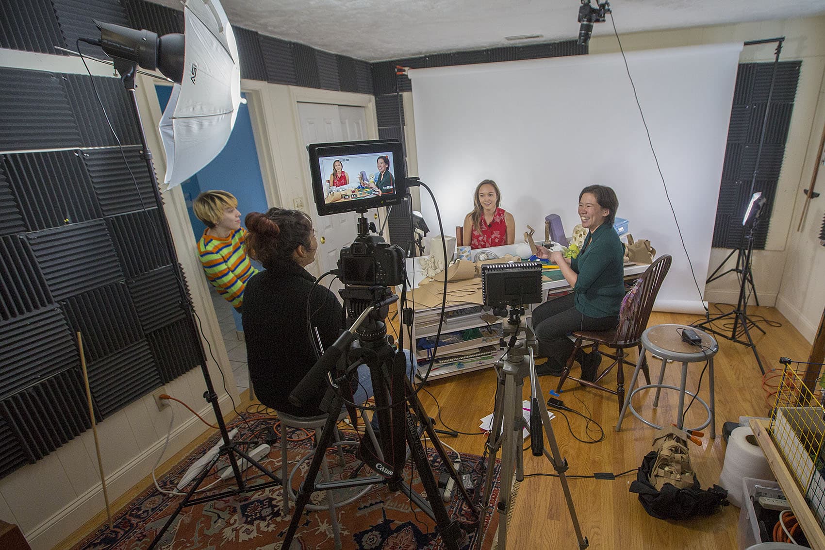 Art Prof co-founder Clara Lieu (far right) jokes with teaching assistants Annelise Yee, Deepti Menon and Lauryn Welch. (Jesse Costa/WBUR)
