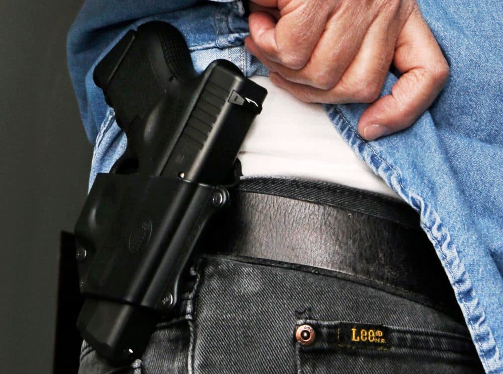 In this 2013 file photo, an Ohio man displays his handgun. (Al Behrman/AP)