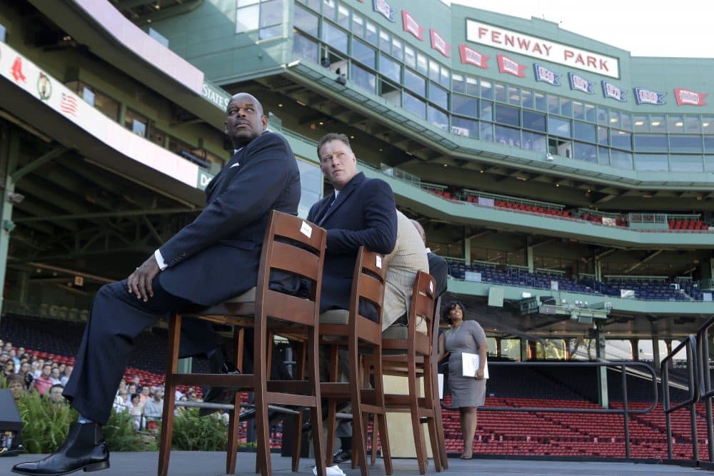 Cedric Maxwell, former Boston Celtics player, left, Bob Sweeney, executive director of the Boston Bruins Foundation, second from left, and Tanisha Sullivan, NAACP Boston branch president, right, look toward a video screen during a panel discussion held to introduce an initiative called "Take The Lead," Thursday, Sept. 28, 2017, at Fenway Park in Boston. The Red Sox, Patriots, Celtics, Bruins, and Revolution are joining a project they're calling "Take the Lead" that was unveiled Thursday. (Steven Senne/AP)