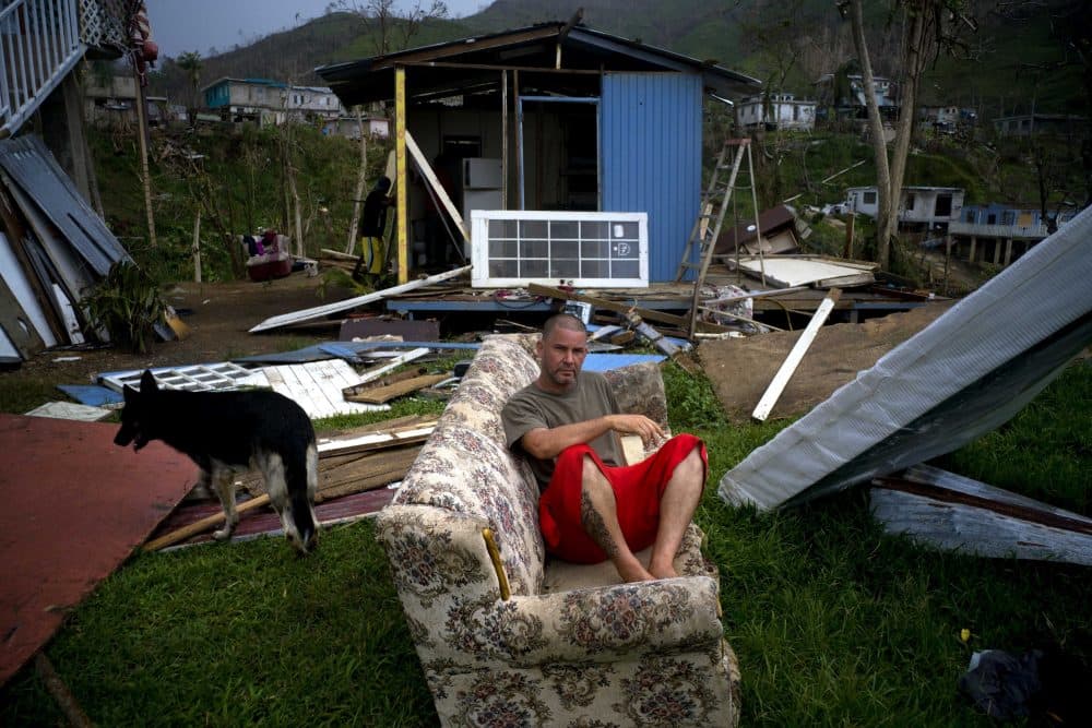 Angel Rodriguez poses next to his belongings in front of his house, destroyed by Hurricane Maria, in the San Lorenzo neighborhood of Morovis, Puerto Rico, Saturday, Sept. 30, 2017. Rodriguez said that it rained and rained. "I was really afraid on the night of the hurricane. But the important thing is to be alive," he said. (Ramon Espinosa/AP)