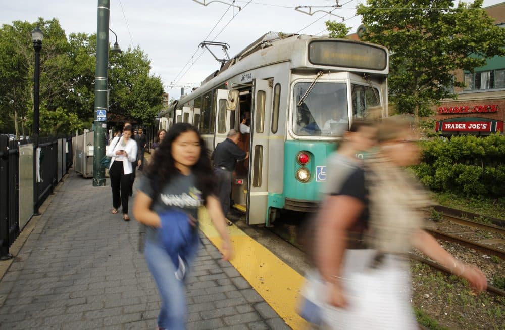 In this June 17, 2015 photo, commuters disembark from a Massachusetts Bay Transportation Authority train in Brookline, Mass. (Steven Senne/AP)