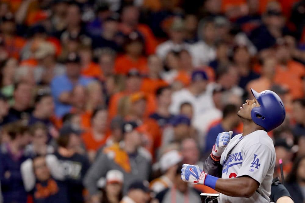 During Game 5 of the World Series, Yasiel Puig (front) hit a home run into the bleachers of Minute Maid Park in Houston. The ball was quickly thrown back onto the field. (Christian Petersen/Getty Images)