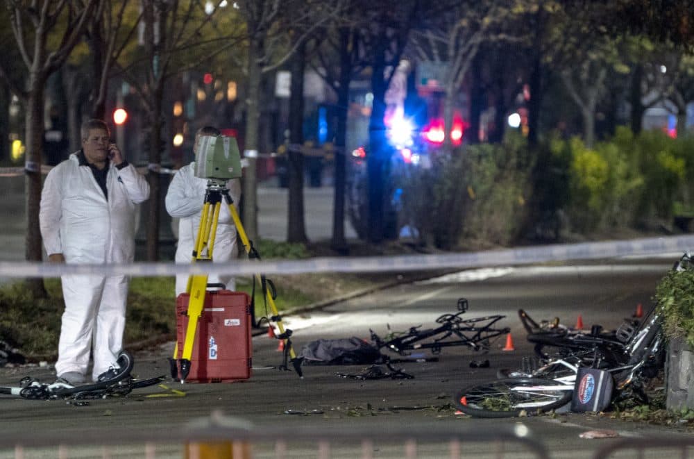 Bicycles and debris lay on a bike path at the crime scene near the World Trade Center memorial on Tuesday. (Craig Ruttle/AP)