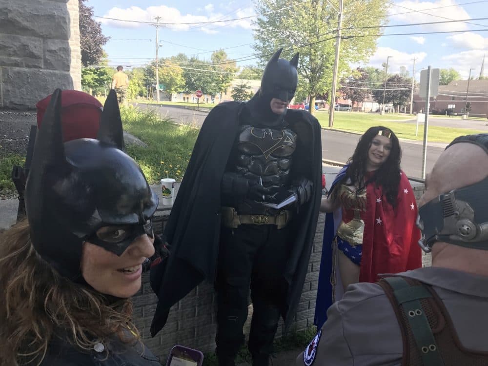 The North Country Crusaders take a moment to plan an upcoming photoshoot after a volunteer gig. (Lauren Rosenthal/North Country Public Radio)
