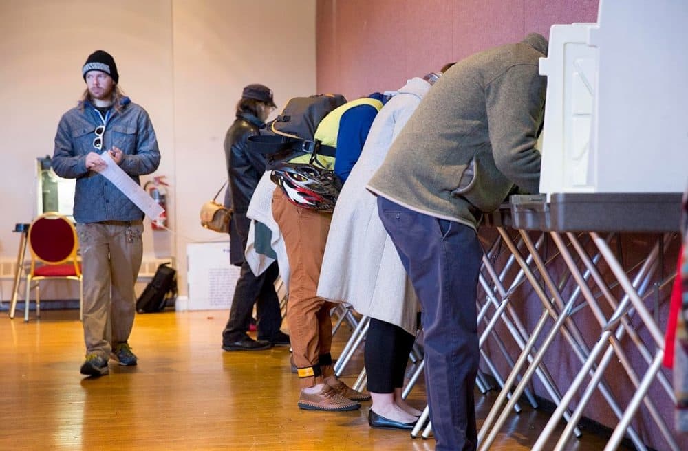 Voters make at the voting booths at the Hellenic Center in Watertown, Mass. (Robin Lubbock/WBUR)