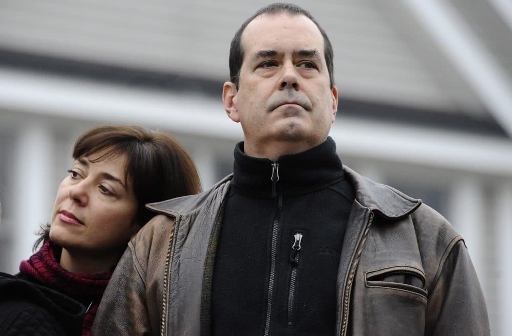Francine and David Wheeler, parents of Sandy Hook School victim Benjamin Wheeler, stand with other families as they address the media, Monday, Dec. 9, 2013, in Newtown, Conn. (Jessica Hill/AP)
