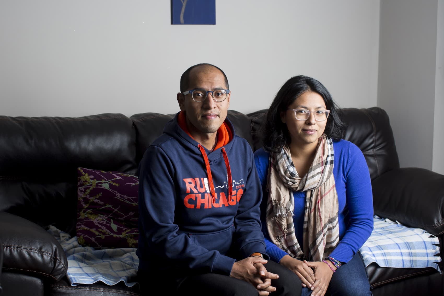 Cristian Mendoza and Laura Mendoza pictured in the home they bought for their parents in Humboldt Park on Nov. 6, 2017, in Chicago. (Michelle Kanaar for Here & Now)