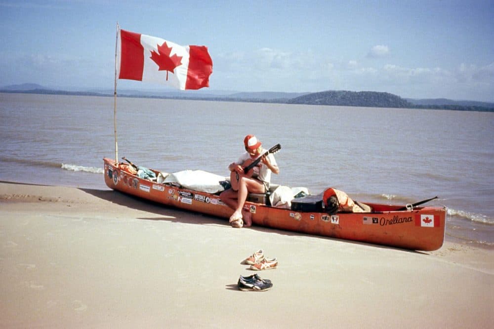 Dana Starkell plays his guitar during a break along the Orinoco River in 1982. (Don Starkell)