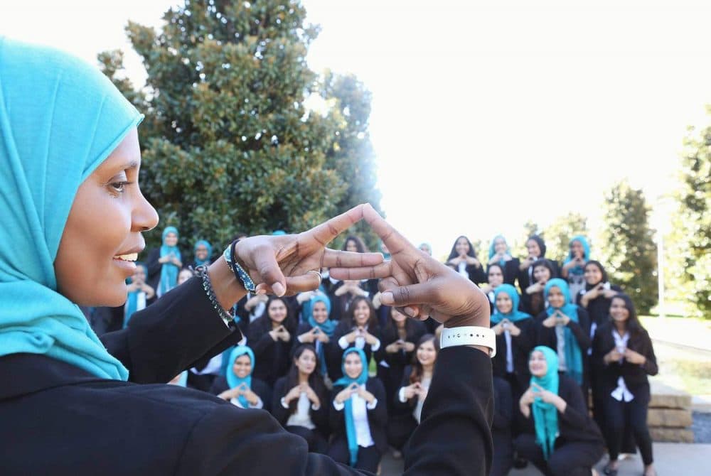 Mu Delta Alpha founder Samira Maddox makes the Delta sign with members of all MDA chapters, who gathered at UT-Dallas on Oct. 8, 2017. (Nida Rehman, courtesy Mu Delta Alpha)
