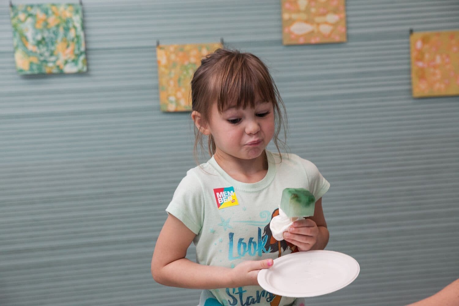 A museum visitor tastes the phytoplankton popsicle at the ICA. (Courtesy Galya Feierman/ICA)