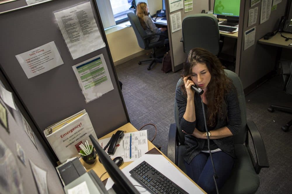 Volunteer Emma speaks with a caller on the Samaritans hotline. (Jesse Costa/WBUR)