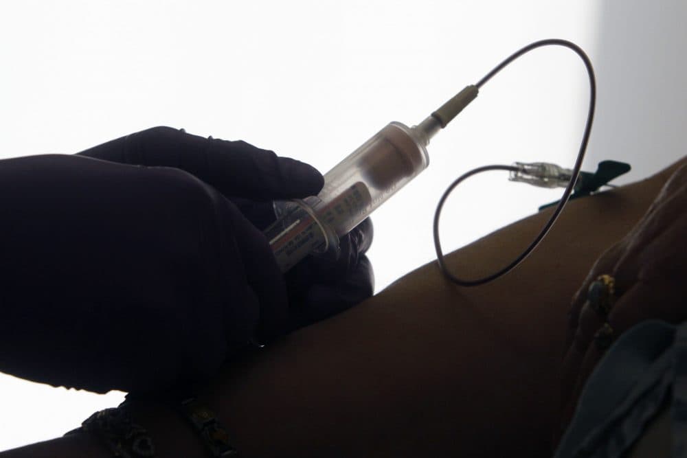 FILE - In this April 28, 2015 file photo, a patient has her blood drawn for a liquid biopsy during an appointment at a hospital in Philadelphia. (Jacqueline Larma/AP)